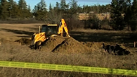 tractor digging up site