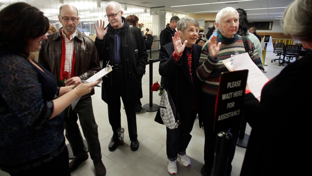 Gay couples seek marriage licenses in Washington