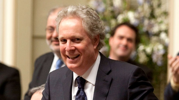 Quebec Premier Jean Charest smiles after winning a non-confidence vote at the legislature in Quebec City, Wednesday, Nov. 24, 2010. (Jacques Boissinot / THE CANADIAN PRESS)