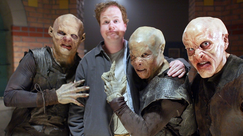 'Buffy the Vampire Slayer' creator Joss Whedon is surrounded by vampires during the taping of the final episode of the cult comedy-horror series in Santa Monica, Calif, April 16, 2003. (AP / Damian Dovarganes)