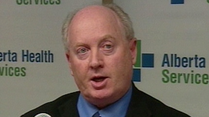 The chairman of Alberta Health Services Ken Hughes speaks during a news conference on November 24, 2010.