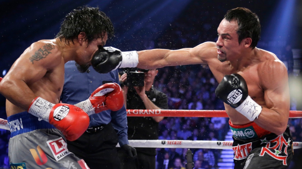 Juan Manuel Marquez punches Manny Pacquiao