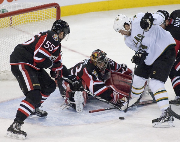 Dallas Stars' Brandon Segal (right) trties to put the puck past Ottawa Senators goaltender Pascal Leclaire (centre) and Ottawa Senators' Sergei Gonchar during second period NHL hockey action in Ottawa on Wednesday, Nov. 24, 2010. THE CANADIAN PRESS/Pawel Dwulit