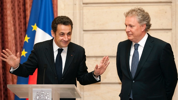 Quebec Premier Jean Charest, seen here with France's President Nicolas Sarkozy in 2009, has arrived in Paris following a non confidence vote. (AP Photo / Philippe Wojazer)