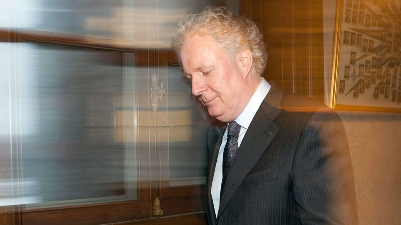 Quebec Premier Jean Charest walks to his office after question period where the Opposition requested the government to hold an inquiry into the attribution of contracts in the construction industry, Tuesday, November 23, 2010, at the legislature in Quebec City. (Jacques Boissinot / THE CANADIAN PRESS)