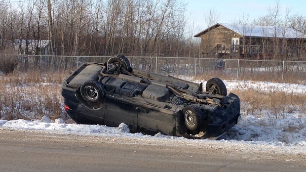 SUV in ditch near Fort Whyte Alive