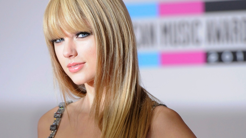 Taylor Swift arrives at the 38th Annual American Music Awards on Sunday, Nov. 21, 2010 in Los Angeles. (AP / Chris Pizzello)