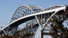 Vehicles cross the Blue Water bridge in Sarnia, Ontario, Friday, March 20, 2009. (Dave Chidley / The Canadian Press)