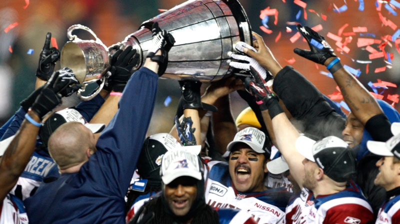 Montreal Alouettes players including quarterback Anthony Calvillo (centre) celebrate their win in the CFL Grey Cup game Sunday November 28, 2010 in Edmonton. (Adrian Wyld / THE CANADIAN PRESS)