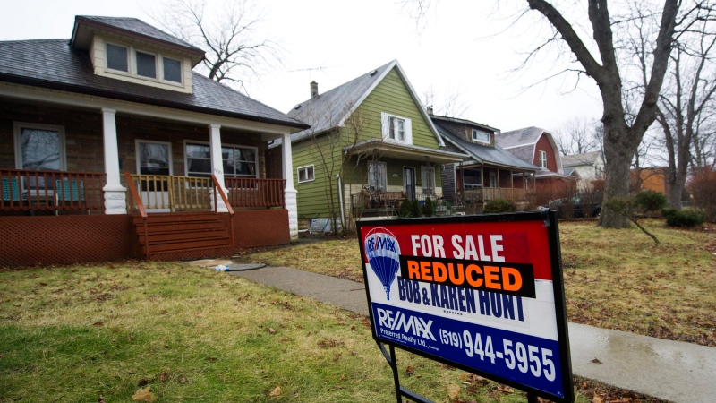 A home with a reduced price is shown in a once vibrant city of Windsor, Ont., in this January 2012 file photo. (Nathan Denette/THE CANADIAN PRESS)