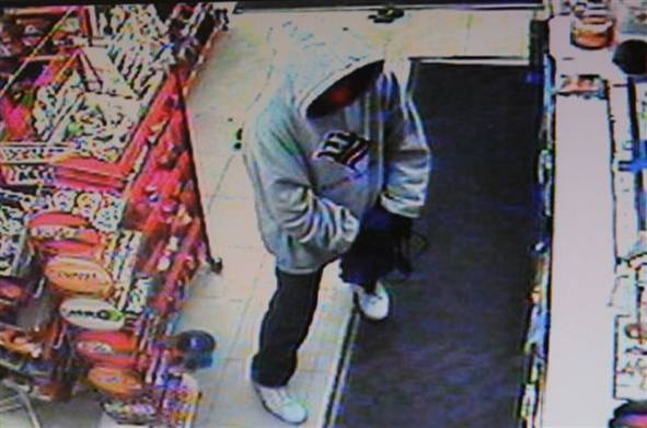 Surveillance photo of alleged robbery suspect at Sterling Variety in Chatham, Ont, Dec. 16, 2012.(Handout / Chatham-Kent police)