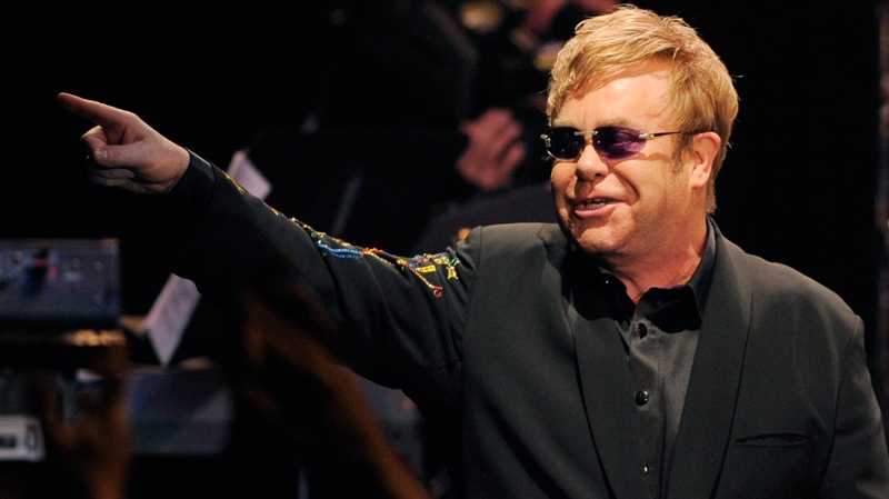 Elton John gestures to the crowd during his joint concert with Leon Russell at the Hollywood Palladium in Los Angeles, Wednesday, Nov. 3, 2010. (AP / Chris Pizzello)
