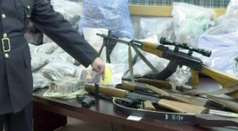 Police seized several deadly weapons and hundreds of thousands of dollars worth of street drugs Tuesday's bust. 