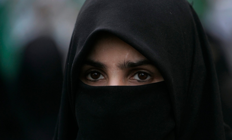 A woman is showing wearing a niqab in this 2011 file photo. (AP / Shakil Adil) 