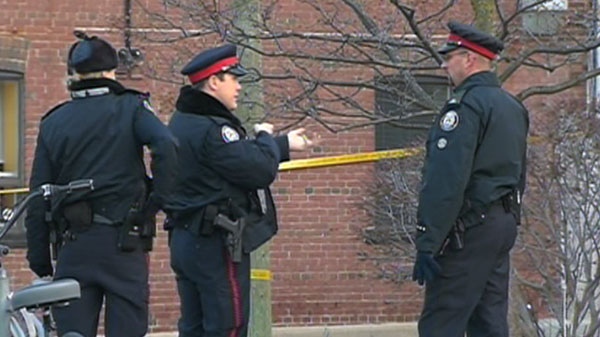 Police investigate the scene of a murder at a Toronto library , Friday, Dec. 3, 2010.