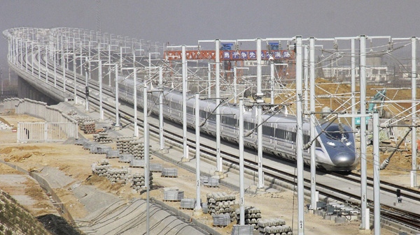 A CRH high-speed train zips in a test run in Zaozhuang, in east China's Shandong province, Friday, Dec. 3, 2010. (AP Photo)