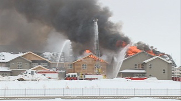 Regina fire crews battle to control a fire in an under-construction care home on Saturday. 