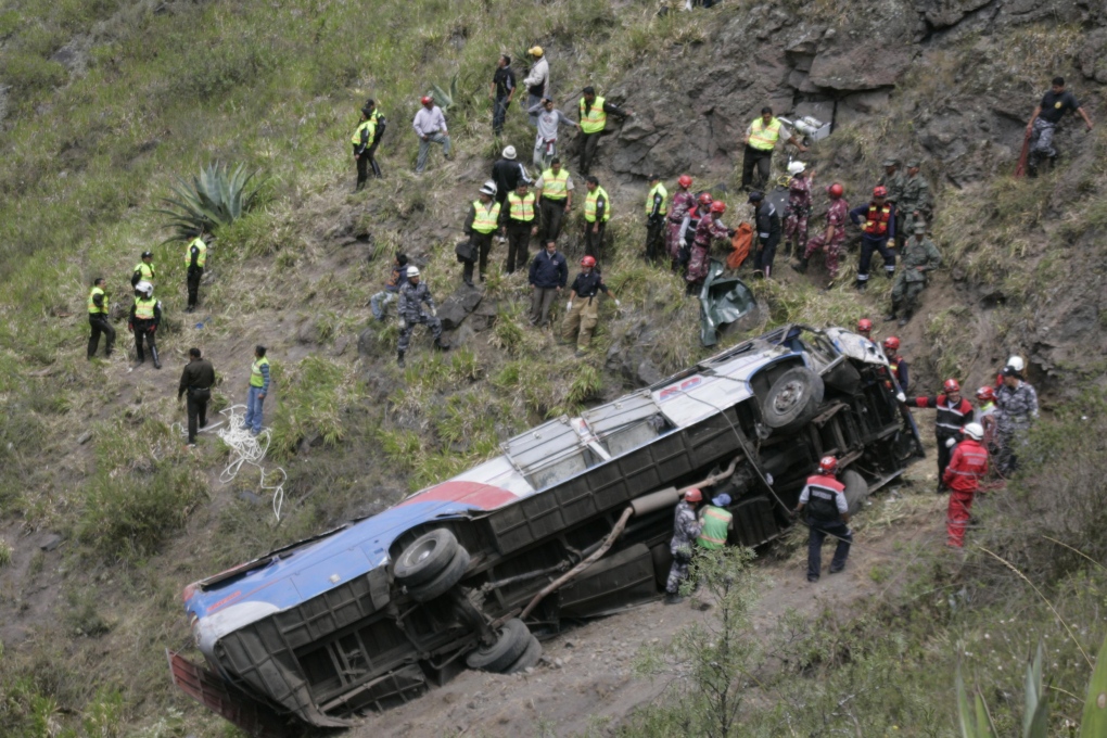 Rescuers at a crashed bus in Ecuador Dec. 26, 2012