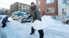 Pascal Morin with son Derek digs out his car in Montreal, Friday, Dec. 28, 2012, following the first major snowstorm of winter in the region. (Graham Hughes / THE CANADIAN PRESS)