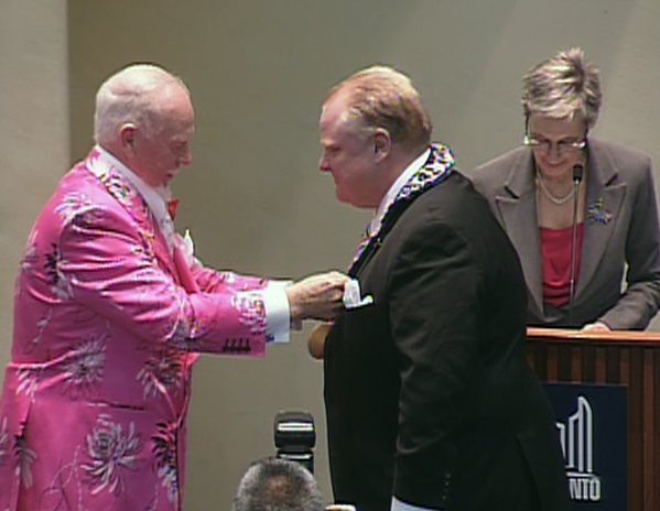 Don Cherry presents Rob Ford with the chains of office during a ceremony at city hall in Toronto, Tuesday, Dec. 7, 2010