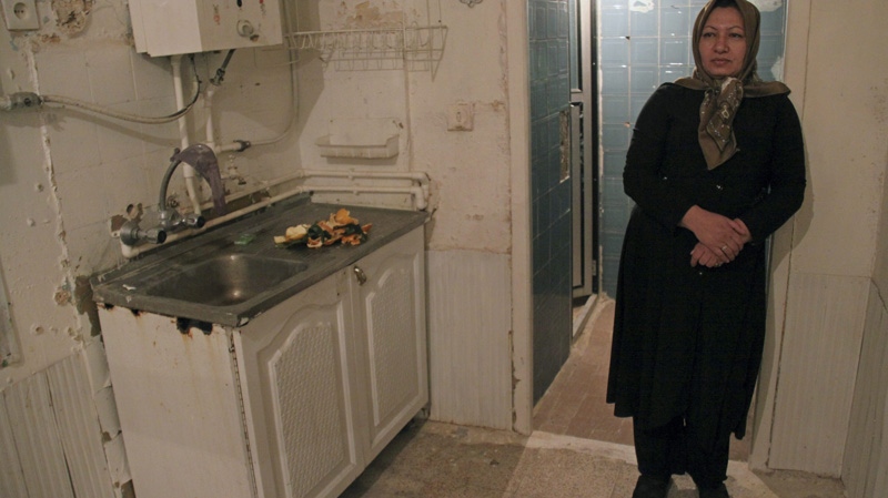 In this photo released by state-run Press TV, Iranian 43-year-old Sakineh Mohammadi Ashtiani, who had been sentenced to death by stoning for adultery, stands at her home, where her husband was killed, in the city of Osku, northwestern Iran, Monday, Dec. 6, 2010. (AP Photo / Press TV)