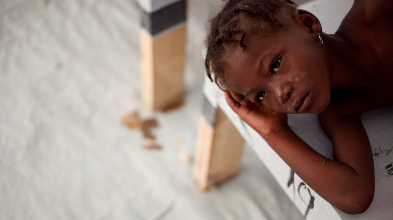 Nadia Pier, a girl suffering cholera symptoms, rests as she is treated at a cholera clinic in Port-au-Prince, Haiti, Monday, Dec.6, 2010. (AP / Guillermo Arias)