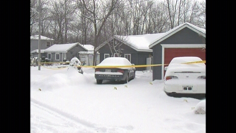 Police tape is seen outside of a home where a person was found dead in Collingwood, Ont.
