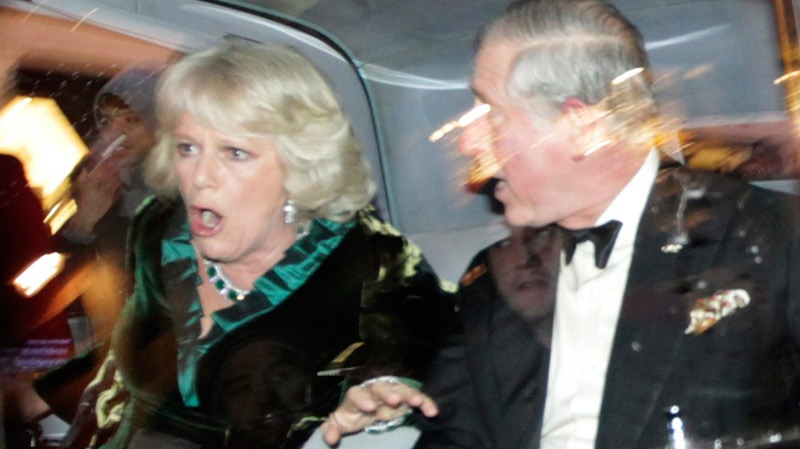 Britain's Prince Charles and Camilla, Duchess of Cornwall, react as their car is attacked by angry protesters in London, Thursday, Dec. 9, 2010. (AP / Matt Dunham)
