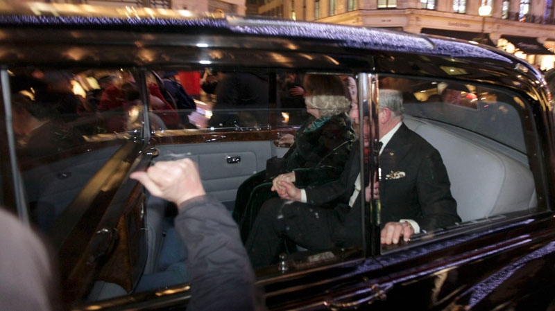 A protester bangs on the window of the car carrying Prince Charles and Camilla, Duchess of Cornwall, in London, Thursday, Dec. 9, 2010.(AP / Matt Dunham) 