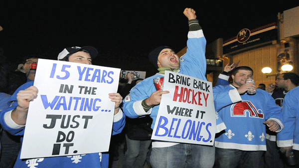 A Quebec-based group named Nordique Nation rallies outside Nassau Coliseum prior to attending the NHL hockey game between the Atlanta Thrashers and the New York Islanders on Saturday, Dec. 11, 2010, in Uniondale, N.Y. The group wants to send a message to NHL commissioner Gary Bettman that they want a team of their own. (AP Photo/Kathy Kmonicek)