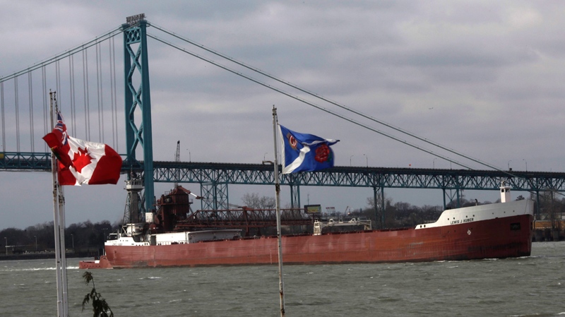 The Ambassador Bridge at the Windsor-Detroit international crossing is pictured as a ship navigates by on 'Black Friday' from Windsor, Ont., Friday, Nov., 26, 2010. (Brent Foster / THE CANADIAN PRESS)    