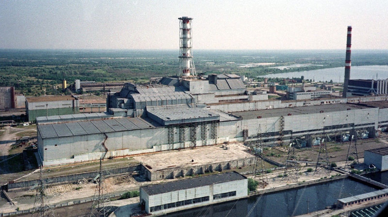 A chimney towers over the sarcophagus that covers destroyed Reactor No. 4 in the Chernobyl nuclear power plant in this July 23, 1998, file photo. (AP Photo/Efrem Lukatsky)