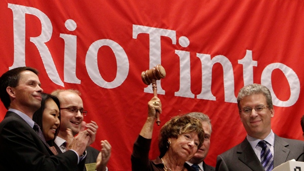 Rio Tinto CEO Tom Albanese, right, watches as his mother, Rosemarie Helm, gavels the market closed after he rang the New York Stock Exchange closing bell, Wednesday, Oct. 6, 2010. (AP Photo/Richard Drew)