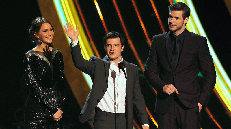 From left, Jennifer Lawrence, Josh Hutcherson, and Liam Hemsworth accept the favorite movie award at the People’s Choice Awards at the Nokia Theatre on Wednesday Jan. 9, 2013, in Los Angeles. (Chris Pizzello/ Invision)