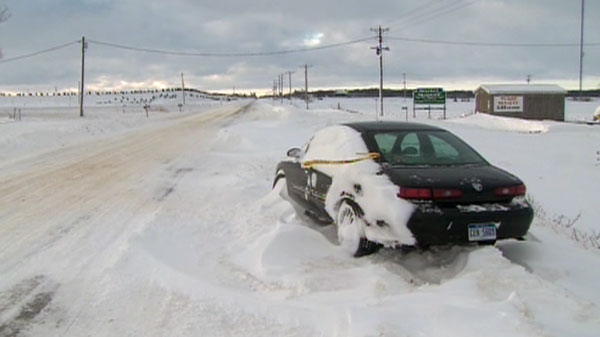 A car sits abandoned on a stretch of Highway 402, Wednesday, Dec, 15, 2010.