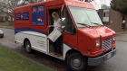 A Canada Post worker leaves a mail truck in Surrey. Dec. 16, 2010. (CTV)
