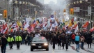 Native protesters march up Wellington Street in Ottawa on Friday, Jan. 11, 2013. (Sean Kilpatrick / THE CANADIAN PRESS)