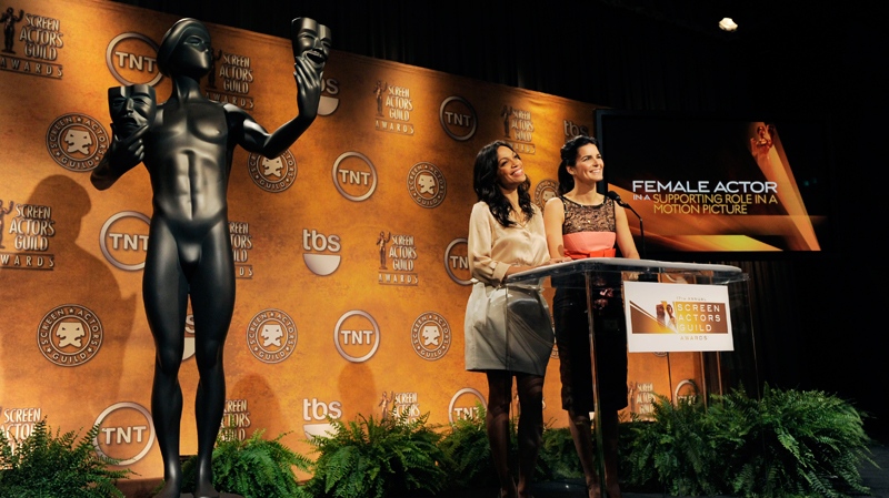 Actresses Rosario Dawson, left, and Angie Harmon announce nominations for the 17th Annual Screen Actors Guild Awards, Thursday, Dec. 16, 2010, in West Hollywood, Calif. The SAG Awards will be held in Los Angeles on Jan. 30, 2011. (AP / Chris Pizzello)