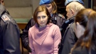 Convicted U.S. student Amanda Knox, center, is escorted by penitentiary guards as she arrives for a hearing in her appeals trial, at Perugia's courthouse, Italy, Saturday, Dec. 18, 2010. (AP / Alessandra Tarantino)