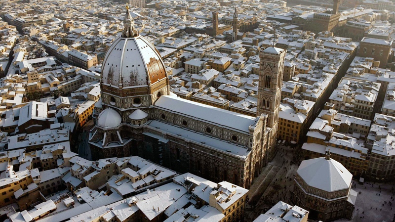 This picture taken Dec. 18, 2010 and made available Monday, Dec. 20, 2010 shows an aerial view of the Tuscan city of Florence. In the foreground is Santa Maria del Fiore Cathedral, also known as the Duomo, and the Battistero, bottom right, in the background top right is the Palazzo Vecchio city hall. (AP / Claudio Scaccini)