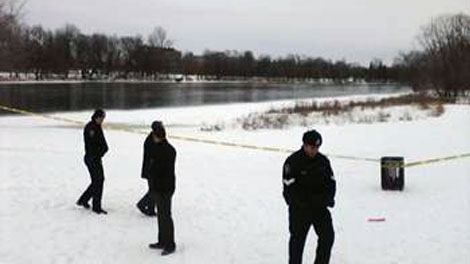 Ottawa police tape marks the scene where a nine-year-old boy was pulled from the Rideau River Tuesday. The boy died in hospital Tuesday, Dec. 21, 2010. 