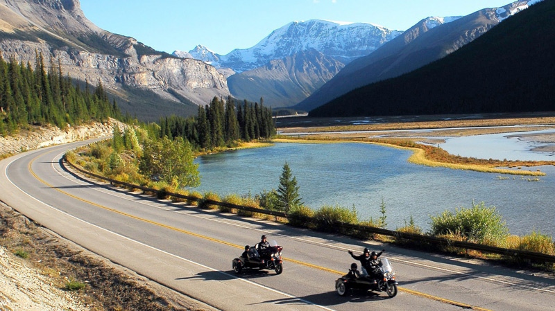 Visitors to Jasper feel the freedom of a chauffeured sidecar tour alongside the Athabasca River in Alberta, in this undated handout photo. (Jasper Motorcycle Tours