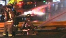 Firefighters battle a blaze at an Eglinton Avenue strip mall early Sunday morning. 