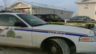 Police cruisers surround a Leduc home after a man was shot three times on Christmas Eve.