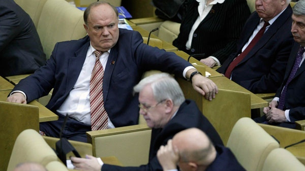 Russian lawmaker and Communist leader Gennady Zyugavov, left, sits during a parliament session in Moscow, Russia, Friday, Dec. 24, 2010. (AP / Misha Japaridze)