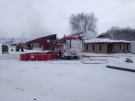 Firefighters battle a structure fire at MDL Doors south of Brussels, Ont. on Wednesday, Jan. 23, 2013. (Scott Miller / CTV London)