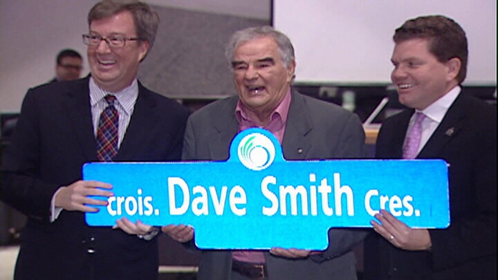 Ottawa Mayor Jim Watson (left) and Councillor Steve Desroches (right) honour philanthropist Dave Smith (centre) by naming a street after him in the community of Riverside South.

