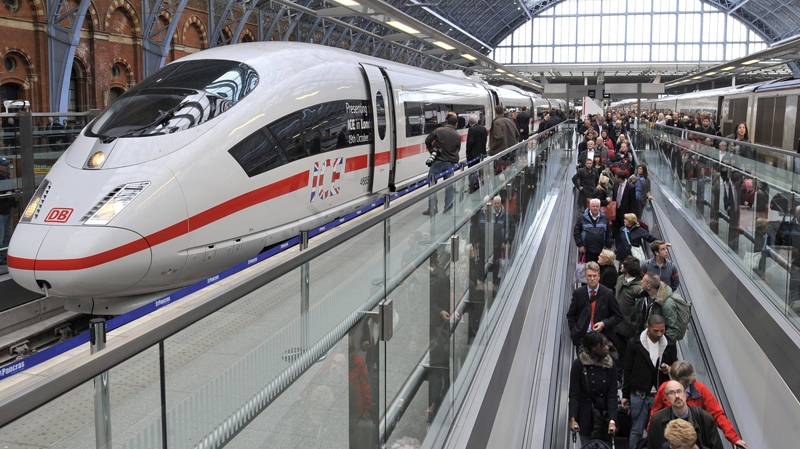 Passengers walk by the German Intercity Express (ICE) high speed train at St. Pancras International Train Station in London, Tuesday, Oct. 19, 2010. (AP / Lennart Preiss)
