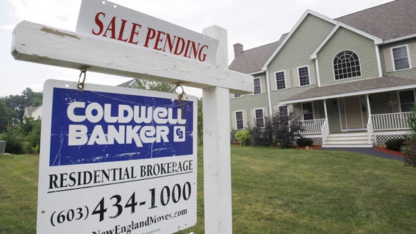 In this photo taken June 28, 2010, a sale pending banner is posted on a real estate sign in Londonderry, N.H. (AP / Charles Krupa)