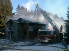 Firefighters battle a house fire on Snyders Road in Petersburg, Ont., on Thursday, Jan. 24, 2013. (Phil Molto / CTV Kitchener)